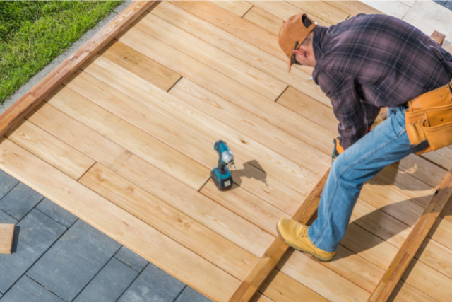 Building a Wooden Deck in His Backyard