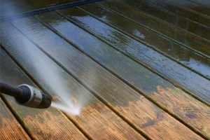 Cleaning deck with a power washer